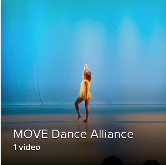 a solo shot of a female dancer in yellow standing against a blue background