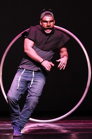 Carlos Cruz in a mask, with hoop