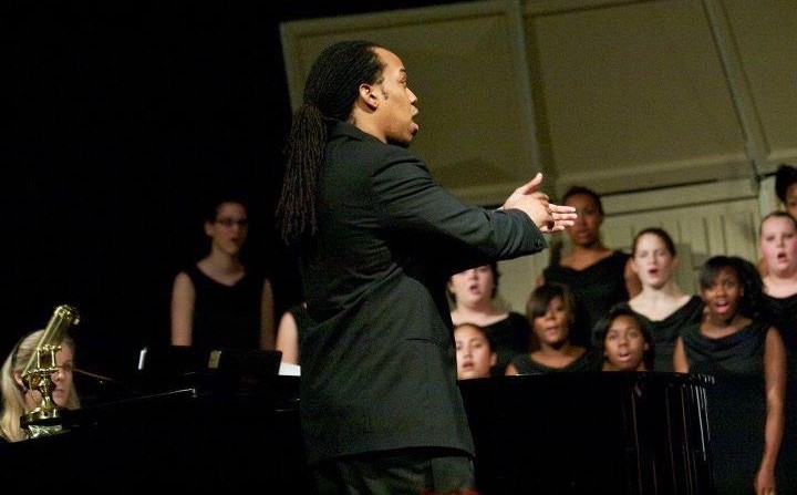 Dungee conducting a high school chorus