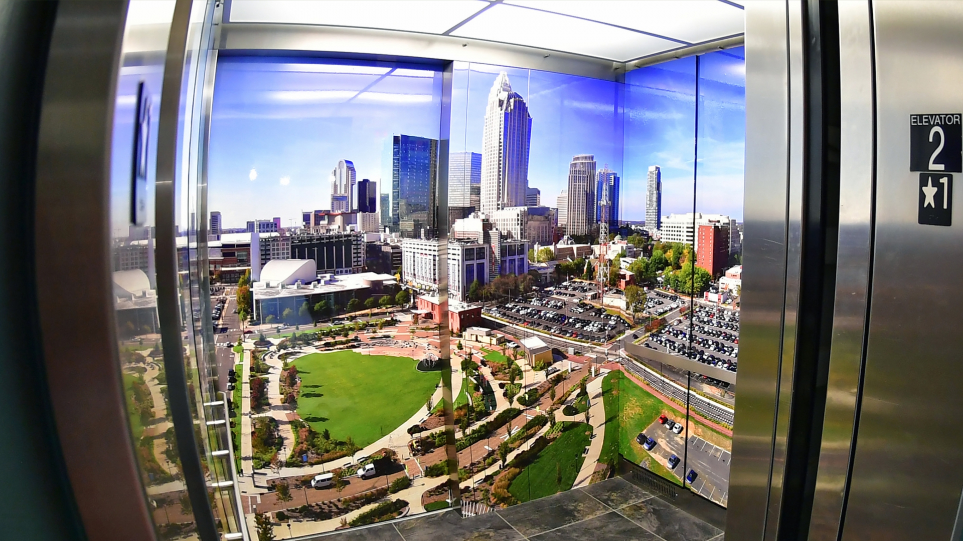 interior of elevator wrapped with cityscape photo